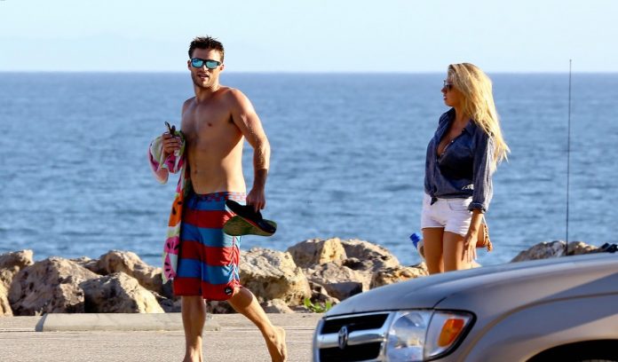 scott-eastwood-shirtless-at-the-beach-with-charlotte-mckinney-09-copy